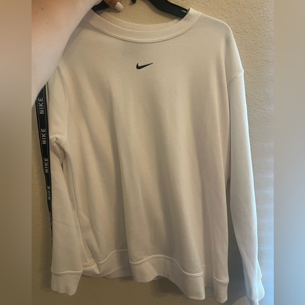 Large NIKE white sweater with black nike outline on sides of sleeves